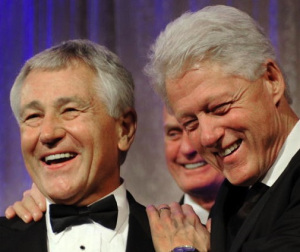 Senator Chuck Hagel (L) enjoys a laugh w