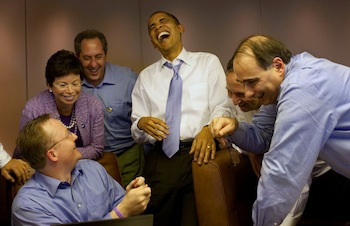 President Obama Laughs with Aides on Air Force One
